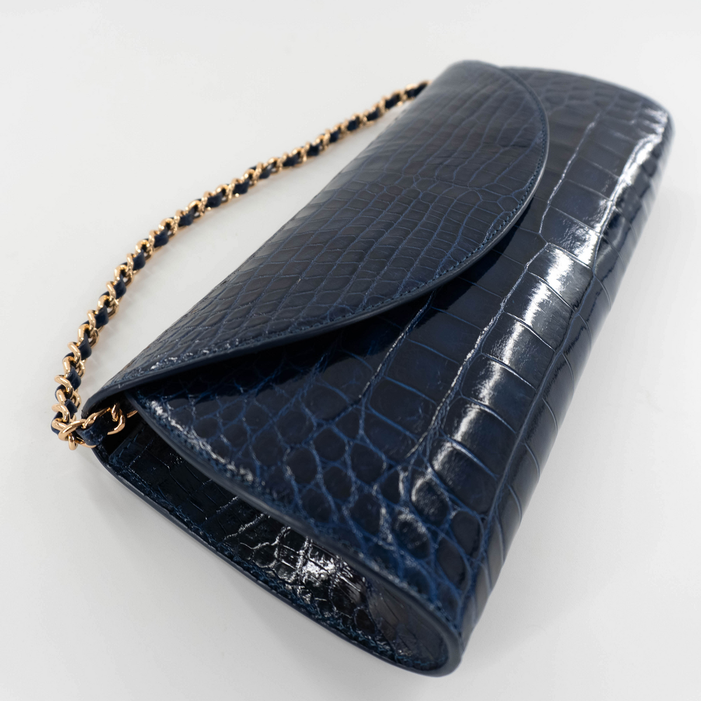Half Moon Clutch in Shiny Navy Blue Crocodile Belly Skin